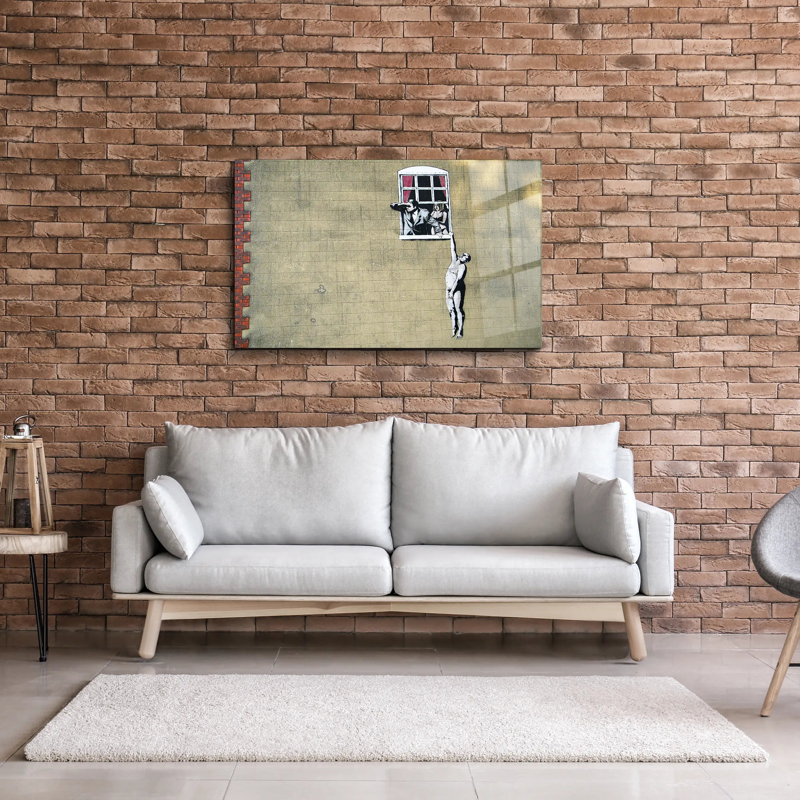 Banksy Man hanging from a window Glass Printing Wall Art